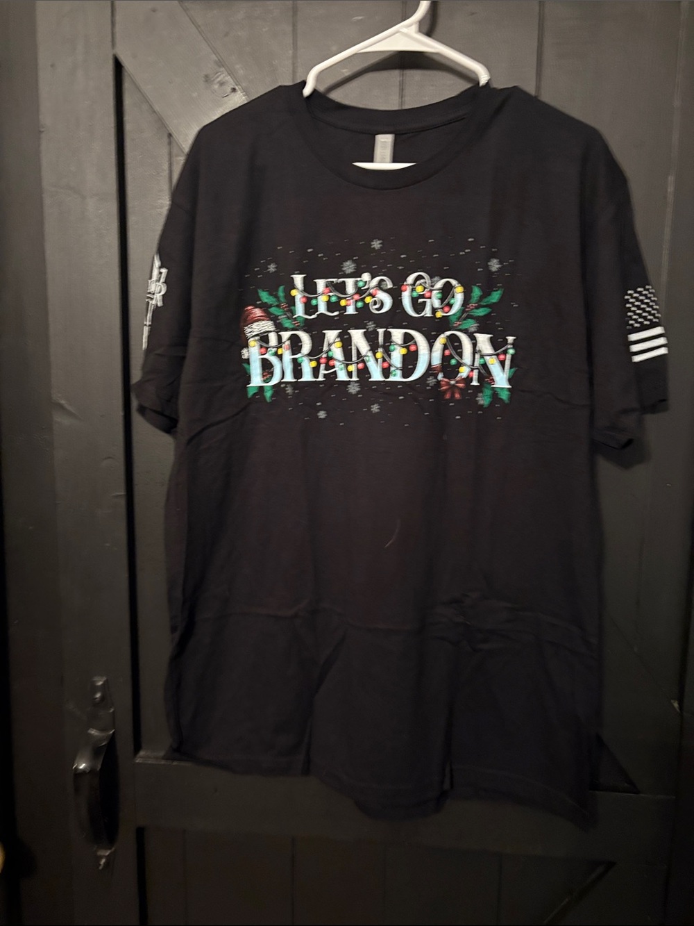 Next Level Apparel Black Short Sleeve Tee with Multicolor Holiday Lettering